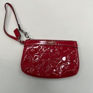 Dark pink Coach wristlet